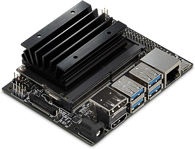 Buy Nvidia Jetson Nano 4GB Developer Kit B01 - a black circuit board with a large heatsink, USB ports, Ethernet port, HDMI port, and power connector.