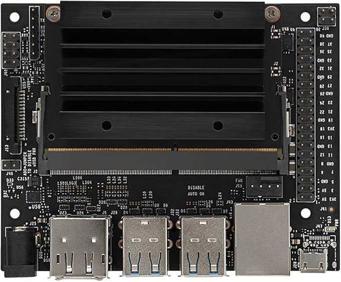 Buy Nvidia Jetson Nano 4GB Developer Kit B01 - a black circuit board with a central heatsink, USB ports, Ethernet port, and various pin connectors.