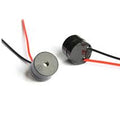 Buzzer Alarm Active Piezo Electronic Wires DC 3‑12V - shown as two small black cylindrical components with attached red and black wires.