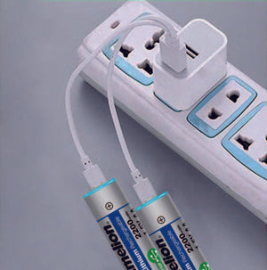 Camelion USB C Rechargeable Lithium Batteries AA – 1.5V – 2200MWH - shown connected to a white USB wall charger by two white charging cables.