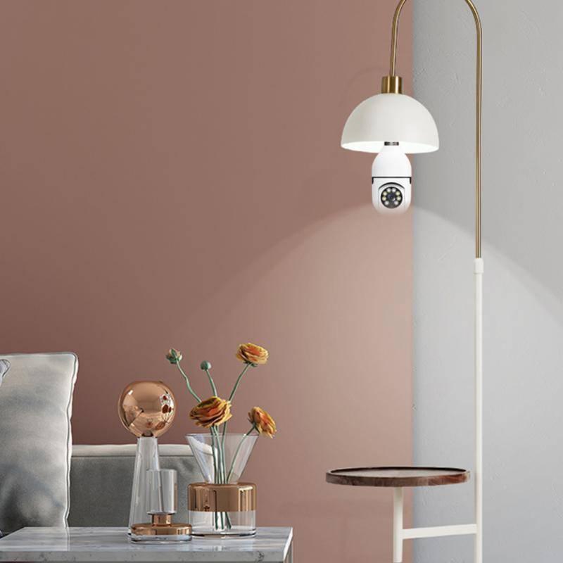 Camera V380 Pro E27 360 Degree LED Light 720P Wireless Panoramic Home Security Bulb Lamp Ip Camera - installed in a white dome lamp shade on a floor lamp.