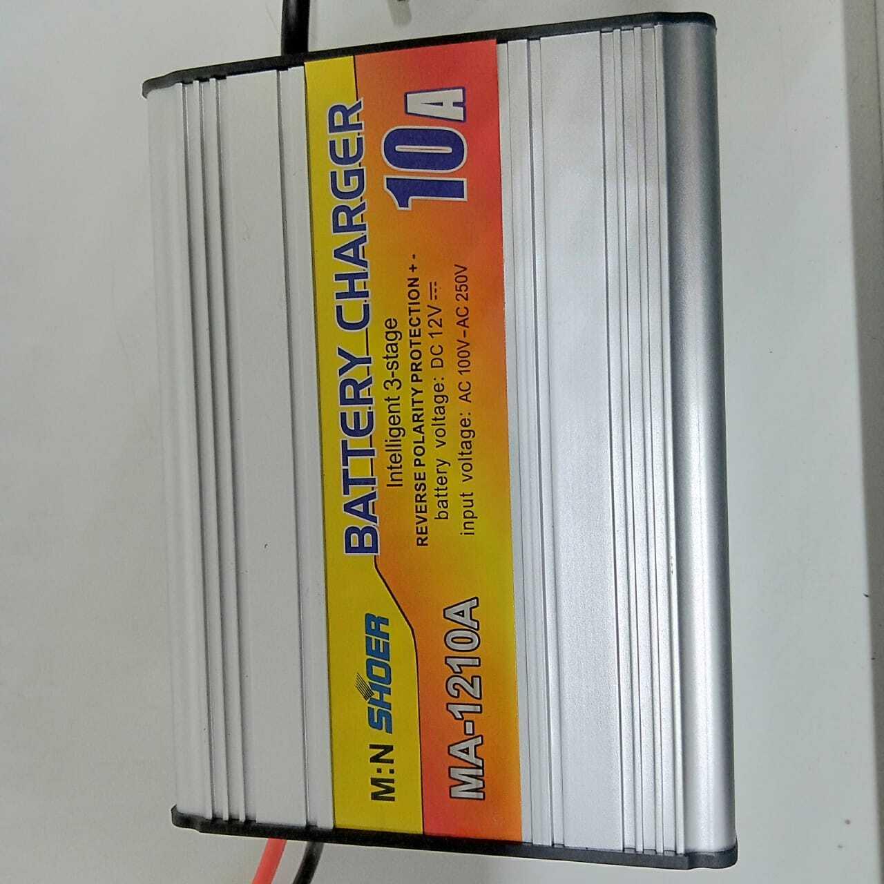 Car Battery Charger 10A 12V Suoer MA-1210A - a rectangular silver metal device with a yellow and red label detailing specifications and brand name.