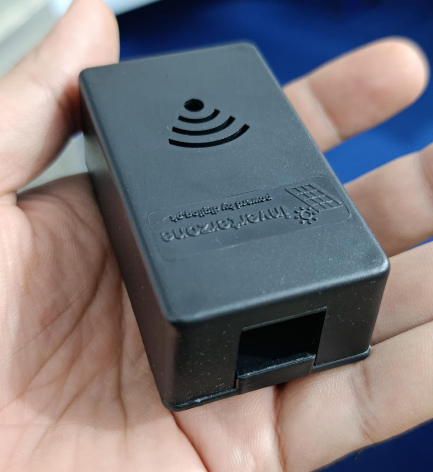 Casing For Inverterzone WiFi Dongle - shown in a hand, featuring a black rectangular plastic shell with a WiFi icon, text, and an RJ45 port.