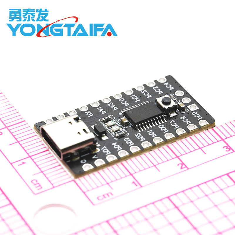 CH32V003F4P6 Risc-v Microcontroller Development Board | Best Price | Digilog - a black rectangular PCB with a USB-C port, a push button, and pin headers, shown on a grid mat.