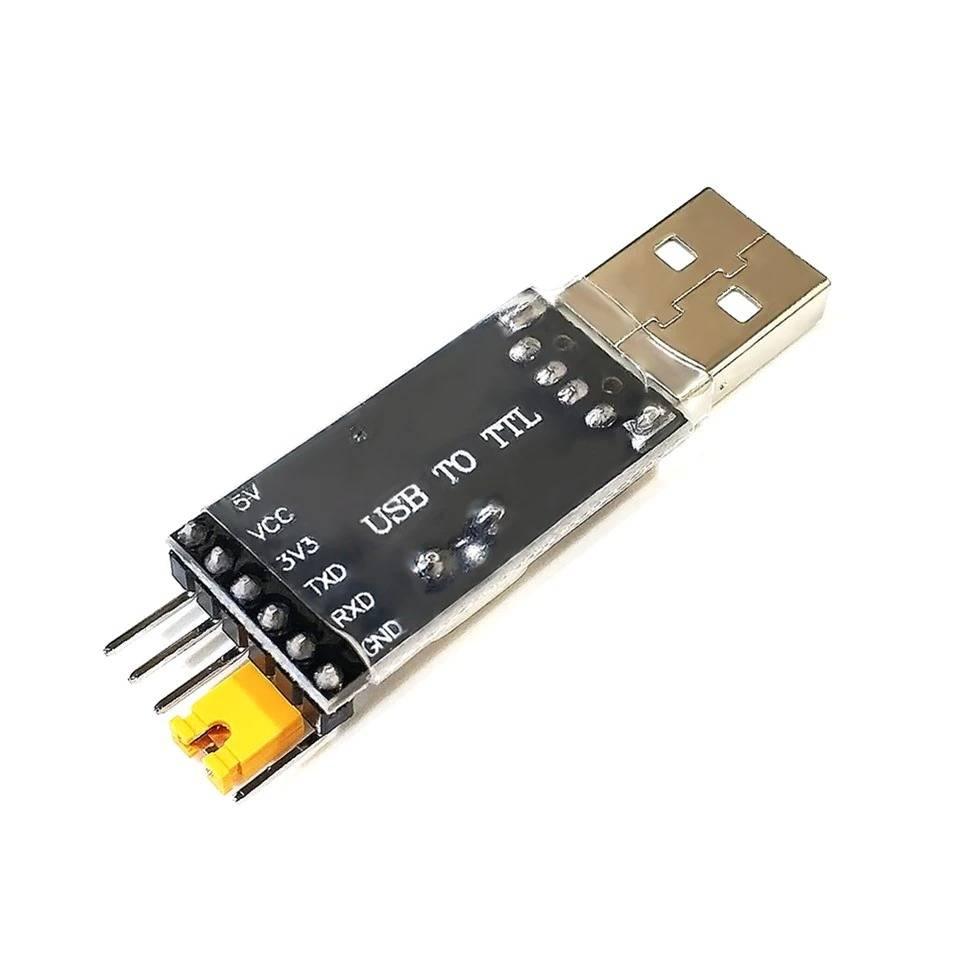 CH340G USB To TTL(serial) Converter For Arduino Nano Raspberry Pi - a black rectangular module with a USB-A connector, six pin headers, and a yellow jumper cap on the 3V3 pin.