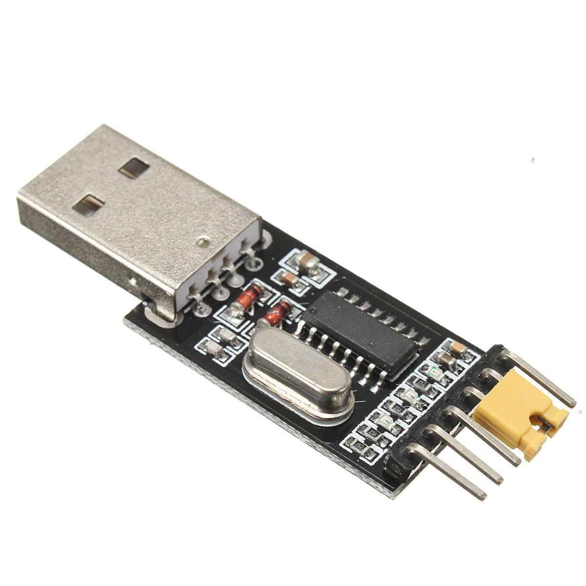 CH340G USB To TTL(serial) Converter For Arduino Nano Raspberry Pi - a black circuit board with a silver USB connector, a metal crystal oscillator, and a yellow jumper cap on header pins.