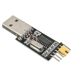CH340G USB To TTL(serial) Converter For Arduino Nano Raspberry Pi - a black circuit board with a silver USB connector, a metal crystal oscillator, and a yellow jumper cap on header pins.