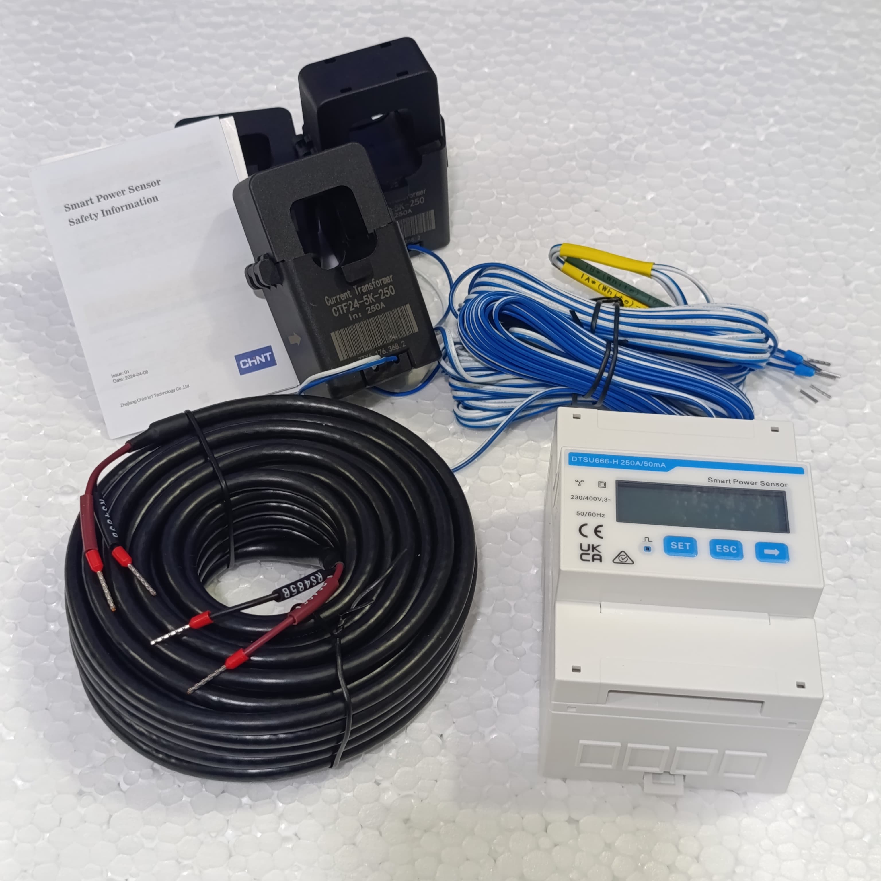 Chint 3 Phase Smart Power Sensor DTSU666-H Smart Meter - kit including a white digital display unit, two black current transformers, a long black RS485 cable, and safety manual.