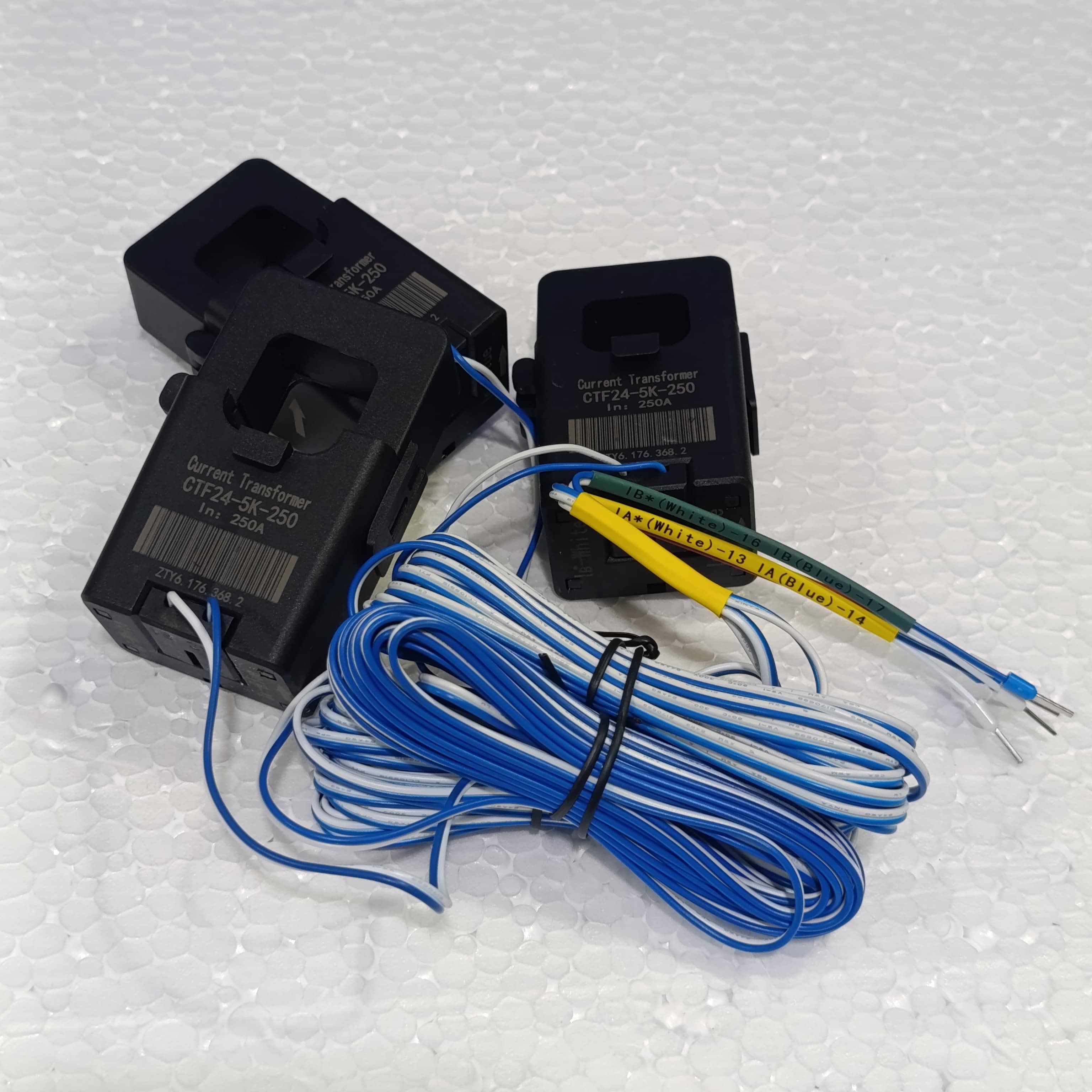 Chint 3 Phase Smart Power Sensor DTSU666-H Smart Meter - three black split-core current transformers with attached blue and white wire leads.