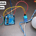 Clap Switch Using Arduino Uno | Parts Only - a blue Arduino Uno connected to a sound sensor module and a relay module, which is wired to a white light bulb.