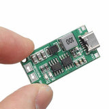 CN3302 Type-C 2S Lithium Battery Charger Module – 8.4V Step-Up Boost Charging Board (3–6V USB-C Input) - a green rectangular circuit board with a USB-C port held between two fingers.