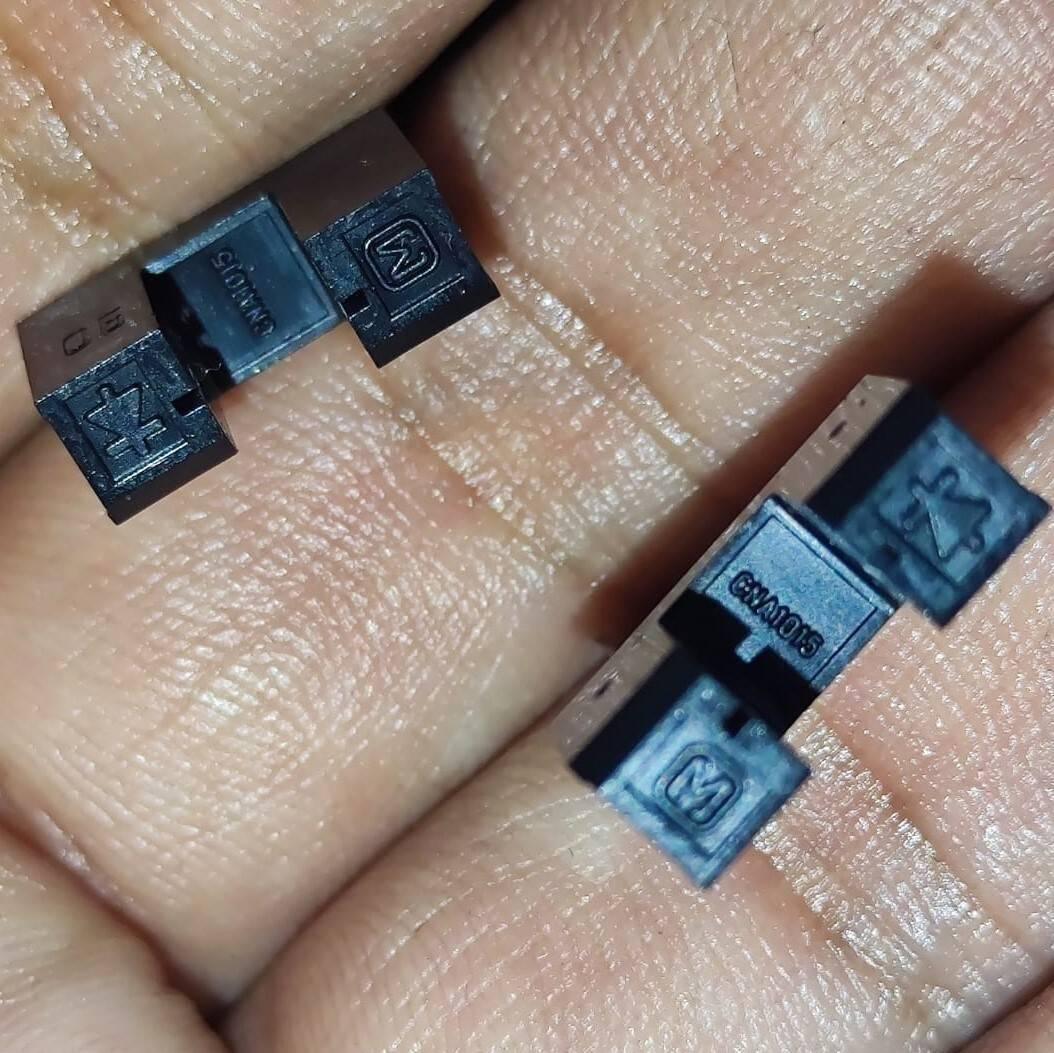 CNA1015 Japan IR u Type Sensor IR Sensor Slot Sensor IR Cut Sensor Photo Interrupter - a close-up showing two black U-shaped photo interrupters held in a hand, each marked with "CNA1015" and an "M" logo.