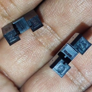 CNA1015 Japan IR u Type Sensor IR Sensor Slot Sensor IR Cut Sensor Photo Interrupter - a close-up showing two black U-shaped photo interrupters held in a hand, each marked with "CNA1015" and an "M" logo.