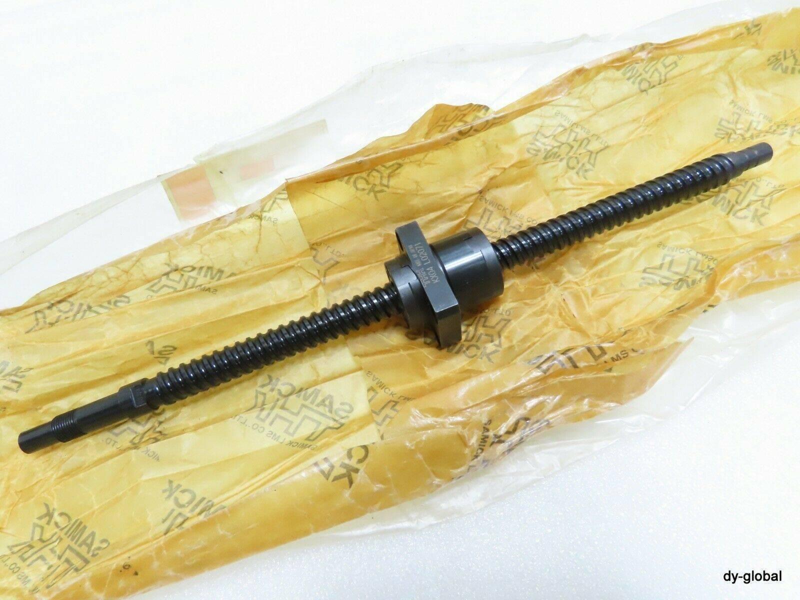 CNC Ball Screw - a black threaded metal rod with a central mounting nut, resting on yellow branded plastic packaging.