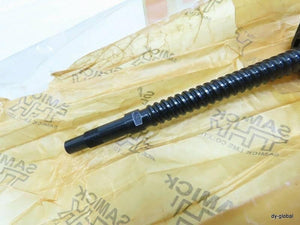 CNC Ball Screw - a close-up of a long, black, threaded metal rod resting on branded yellow protective paper.