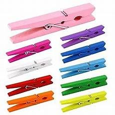 Colorful Push Pin With Wooden Clips 50mm - shown as a collection of ten wooden clothespins in various colors including pink, purple, blue, green, and yellow.