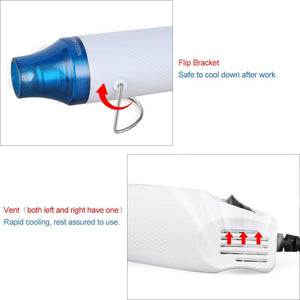 Compact 300W Mini Heat Gun – Portable Craft Heat Tool For DIY, Embossing, Paint Drying & Shrink Wrap - a close-up of its flip-out metal stand and the side air ventilation slots on the white handle.