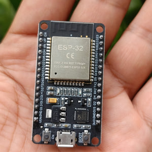 Compatible Wroom ESP32 WiFi Based Microcontroller Development Board Nodemcu CH9102X - a black rectangular circuit board with a USB port, two buttons, and pin headers.