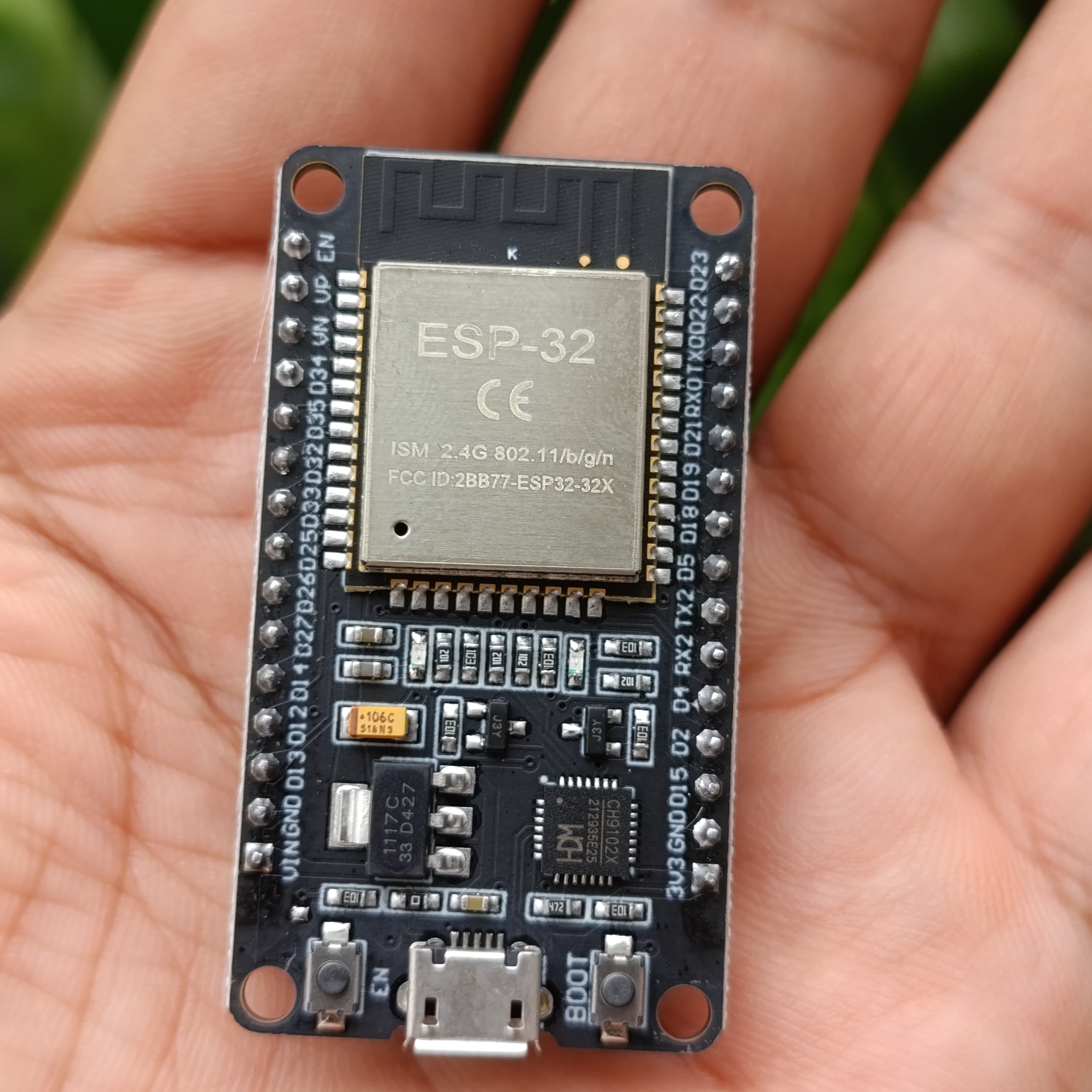 Compatible Wroom ESP32 WiFi Based Microcontroller Development Board Nodemcu CH9102X - a black rectangular circuit board with a USB port, two buttons, and pin headers.