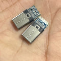 Connector USB 3.1 Type C Connector 16 Pin Male Socket - two silver and blue metal male connectors resting on a palm.