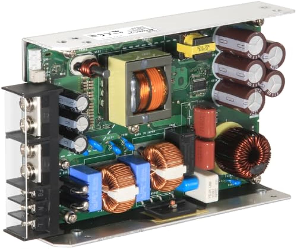 Costel AEA600F-24 24V 25A 600W (peak 1260W) Industrial AC-DC Power Supply - an open-frame green circuit board with copper coils, capacitors, and a black terminal block input.