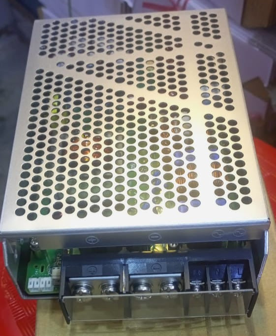 Costel AEA600F-24 24V 25A 600W (peak 1260W) Industrial AC-DC Power Supply - a rectangular silver metal unit with a perforated top cover and a terminal block with screw connectors on the front.