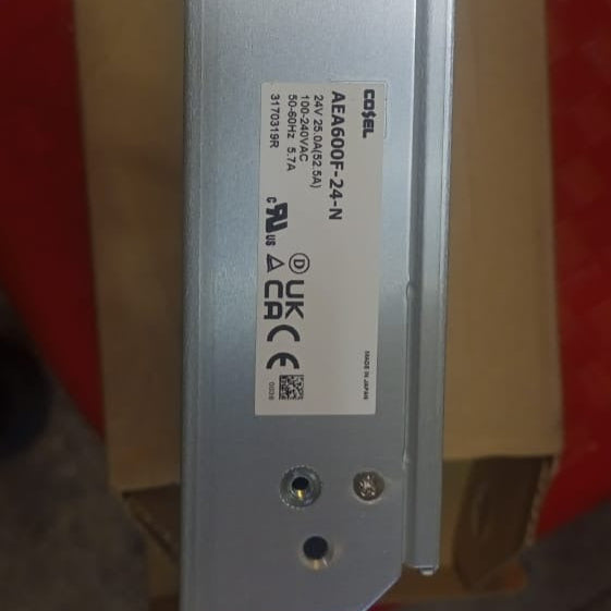 Costel AEA600F-24 24V 25A 600W (peak 1260W) Industrial AC-DC Power Supply - a close-up view of the silver metal side panel showing the printed product specifications and regulatory certification logos.