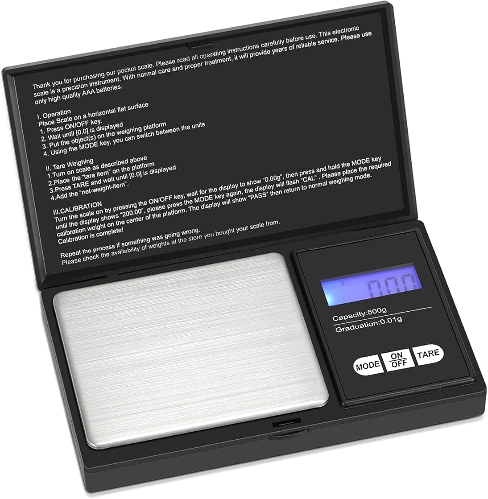 CX258 500G 0.01G Digital Pocket Gram Scale Precision Electronics Weighing Jewelr - a black rectangular device with a silver weighing platform, blue screen showing 0.00, and three control buttons.