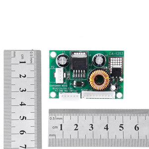 D120533V 12V DC Step Down Convertor Module CA1253 DC To DC Buck Converter - shown on a white background next to two metal rulers to indicate its dimensions.