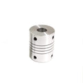 D19-25-6.35-6.35 Stepper Motors & Parts Fixed Coupling Series - a cylindrical silver metal shaft coupler with a central bore and four side set-screw holes.