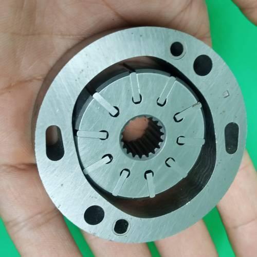 Danny Pump Cartridge 34079623001 - a close-up view of a circular, metallic hydraulic pump rotor with internal splines held in a hand.