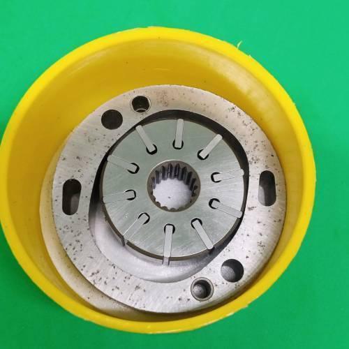 Danny Pump Cartridge 34079623001 - a metallic splined rotor and plate assembly, shown inside a yellow plastic protective container.