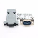 dB-9 DB9 RS232 Male Connector - shown with a grey plastic hood, a nine-pin male connector, and included metal mounting screws and cable clamp accessories.