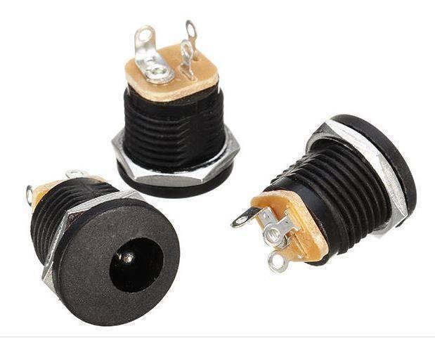 DC-022 DC Power Jack PCB Mount Female Connector 3 Pin With Nut 5.5mm x 2.1mm - three black cylindrical units with metal nuts and exposed metal pins shown from multiple angles.