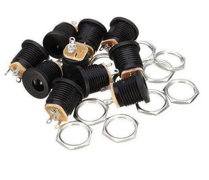DC-022 DC Power Jack PCB Mount Female Connector 3 Pin With Nut 5.5mm x 2.1mm - a pile of black cylindrical connectors with metal mounting nuts.