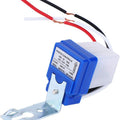 DC 12V Photocell Sun Switch Automatic On/off Light Control Sensor Switch 10A Day Night Sensor Switch For Lights - with a blue and white plastic housing, a metal mounting bracket, and three protruding red, white, and black wires.