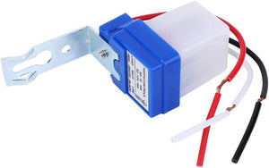 DC 12V Photocell Sun Switch Automatic On/off Light Control Sensor Switch 10A Day Night Sensor Switch For Lights - with a blue and white casing, metal mounting bracket, and three exposed red, white, and black wire leads.
