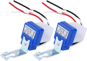 DC 12V Photocell Sun Switch Automatic On/off Light Control Sensor Switch 10A Day Night Sensor Switch For Lights - two identical blue and white light sensor switches with attached red, black, and white wires and metal mounting brackets.