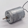 DC 2V To 24V 5100 RPM High Torque Mini Micro Motor DC Motor - a cylindrical silver metal DC motor with a small brass gear on the shaft and two wire leads.