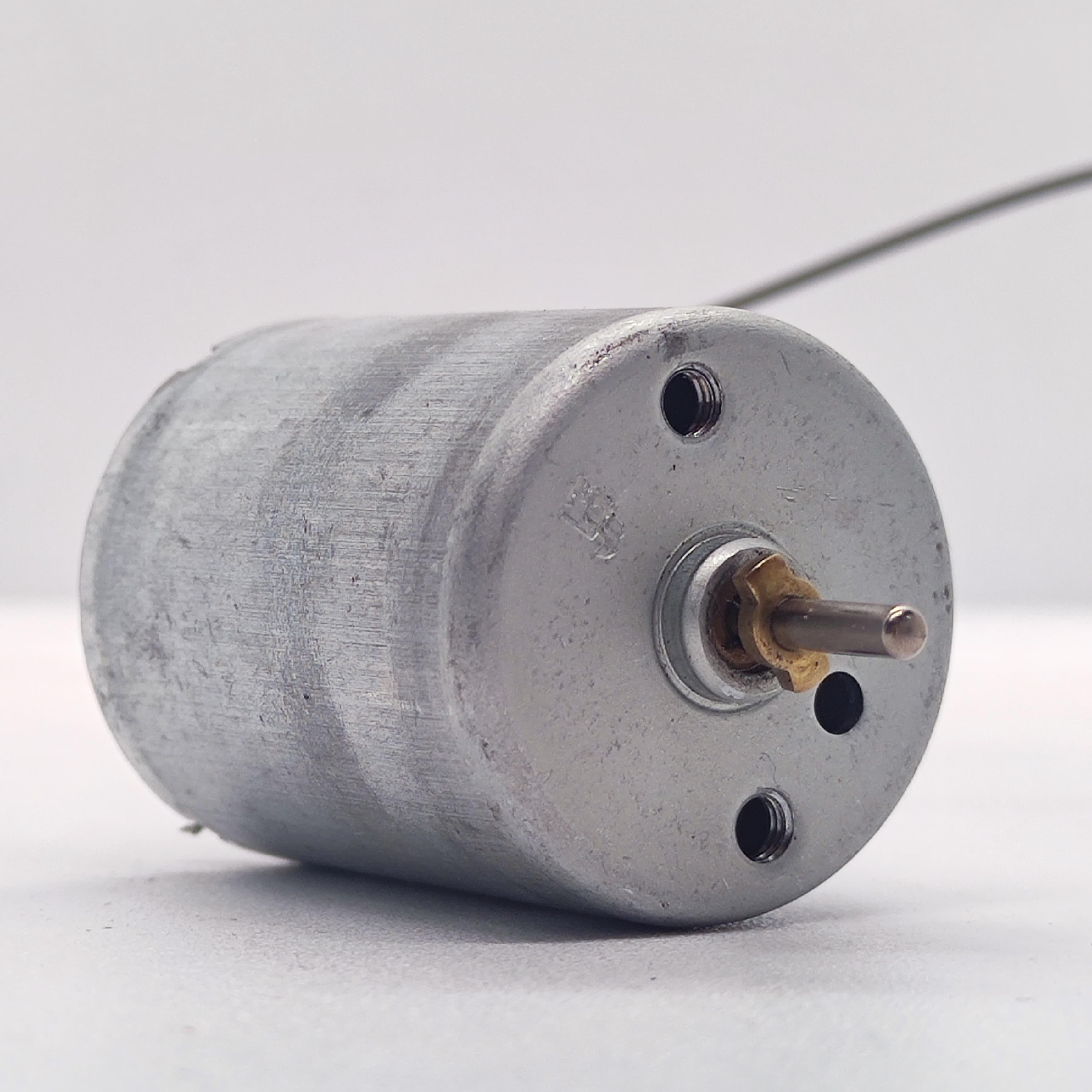 DC 2V To 24V 5100 RPM High Torque Mini Micro Motor DC Motor - a cylindrical silver metal DC motor featuring a central rotating shaft and two threaded mounting holes.