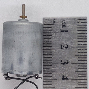DC 2V To 24V 5100 RPM High Torque Mini Micro Motor DC Motor - shown as a silver cylindrical motor with a metal shaft next to a metal ruler for size reference.