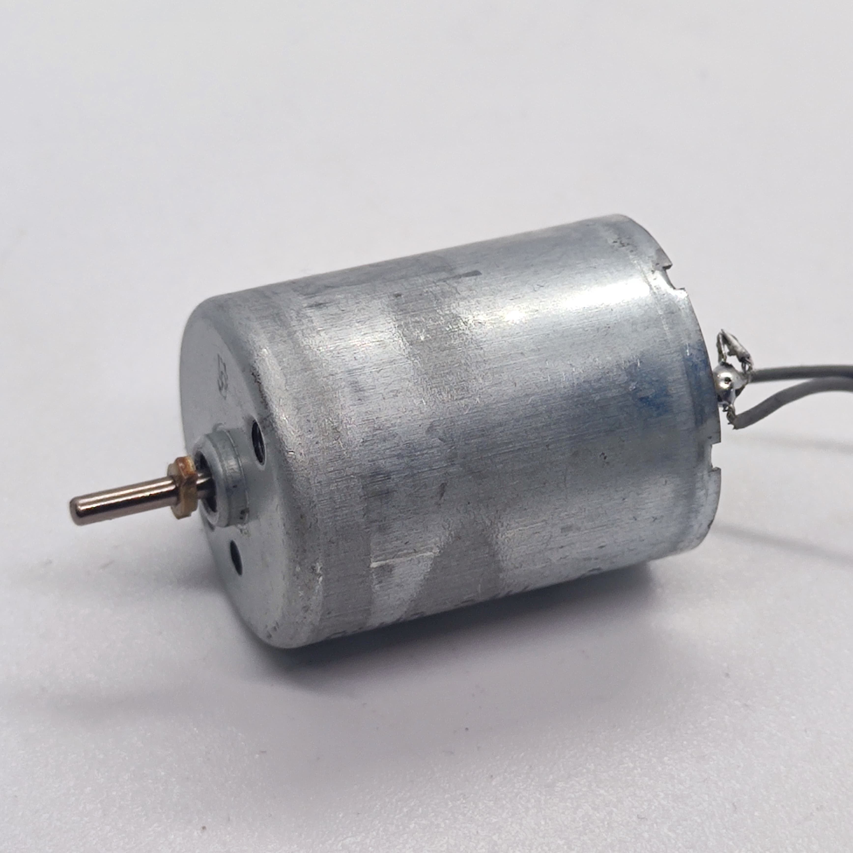 DC 2V To 24V 5100 RPM High Torque Mini Micro Motor DC Motor - a silver cylindrical DC motor with a metal shaft and two attached electrical wires.