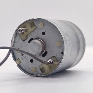 DC 2V To 24V 5100 RPM High Torque Mini Micro Motor DC Motor - a close-up of the rear end showing two soldered wire terminals on a silver cylindrical motor housing.