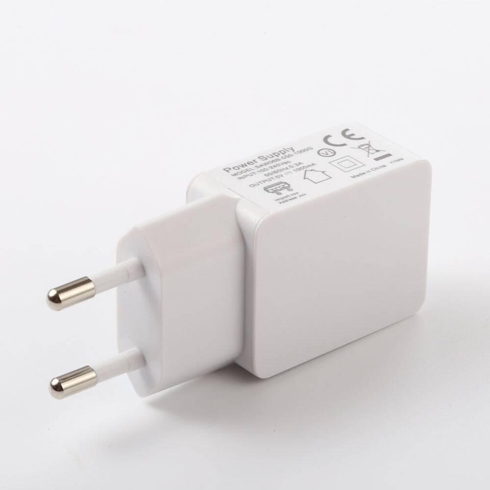 DC 5V 2A Or 2.5A Or 3A 100-240VAC - a white, rectangular wall adapter with two round prongs and a USB port on the side.