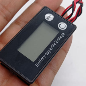 DC 8V-100V Battery Capacity Indicator Lead Acid Lithium LiFePO4 Car Motorcycle Voltmeter Voltage Gauge 12V 24V 48V 72V - a rectangular black digital voltmeter held in a hand, featuring a blank LCD screen and two circular buttons.