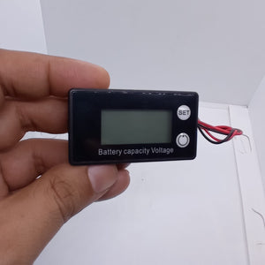 DC 8V-100V Battery Capacity Indicator Lead Acid Lithium LiFePO4 Car Motorcycle Voltmeter Voltage Gauge 12V 24V 48V 72V - a black rectangular digital gauge held in a hand, featuring a blank screen, a SET button, and a power button.