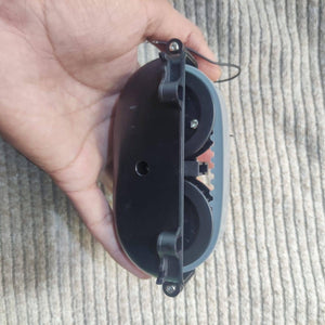 DC Gear Motor With 3.7V To 12V Operated - shown in a close-up, featuring a black plastic casing with two grey wheels and a toothed gear mechanism.