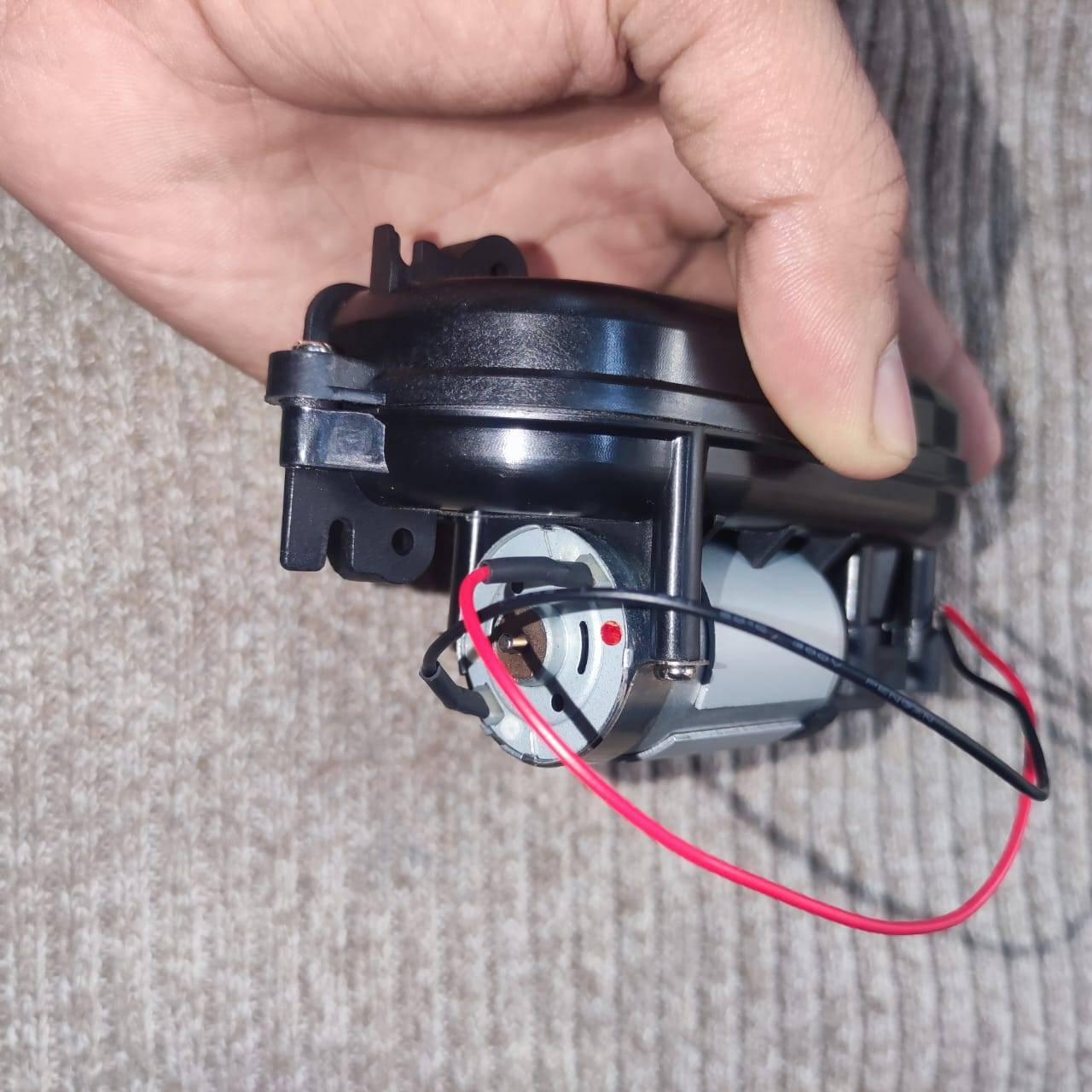 DC Gear Motor With 3.7V To 12V Operated - shown as a close-up of a silver cylindrical motor with red and black wires attached to a black plastic housing.