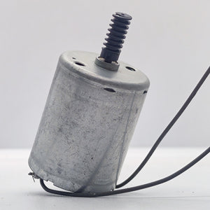 DC Motor 2V To 24V 5100RPM - a silver cylindrical motor with a black worm gear on the shaft and two black wires extending from the base.