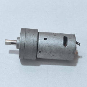 DC Motor DC Electric Geared Motor - shown from the side, featuring a silver cylindrical motor body attached to a metallic gearbox with a D-shaped output shaft.